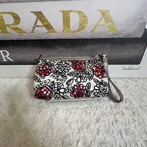 Coach poppy Wristlets with floral pattern and Silver accents